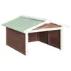 A wooden structure with a green roof, likely a shelter for a robot lawnmower.