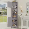 A gray corner cabinet filled with toiletries and towels, placed next to a window with a view of greenery. Náhled obrázku produktu