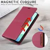 A red leather flip wallet phone case is shown on a wooden surface next to a laptop. Produktbild-Vorschau