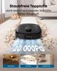 A robot vacuum cleaner is shown on a carpet, with text overlay describing its suction power and three inset images showing different types of debris it can clean. Náhled obrázku produktu