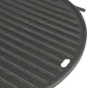 A close-up view of a round cast iron grill plate with parallel ridges. Produktbild-Vorschau