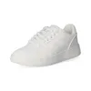 A white Champion Rebound 2.0 Low sneaker is shown from a side angle against a white background. Podgląd zdjęcia produktu