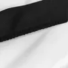 A close-up view of a fabric seam with black trim on a white background. Produktbild-Vorschau
