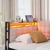 A bed with a tufted headboard and a shelf with LED lighting above it, featuring decorative items and a tablet. Podgląd zdjęcia produktu