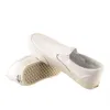 A pair of white Vans slip-on shoes are shown against a white background. Produktbild-Vorschau