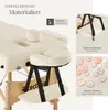 Close-up of a massage table with various features highlighted by text and inset images. Náhled obrázku produktu