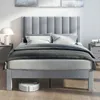 A bedroom scene with a bed, nightstands, and a robot vacuum cleaner. Náhled obrázku produktu