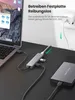 A laptop connected to a USB hub, which is also connected to an external hard drive and a power adapter. Produktbild-Vorschau