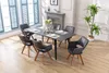 A dining room set with a table and chairs. Produktbild-Vorschau