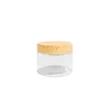 A clear studio shot of a small, transparent jar with a wooden lid. Produktbild-Vorschau