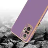 A close-up of a purple phone case with gold trim, shown at an angle, with a cracked ground effect in the background. Produktbild-Vorschau