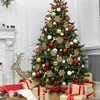 A decorated Christmas tree with presents underneath, a fireplace, and a decorative reindeer. Náhľad obrázku produktu