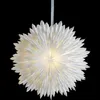 A white paper star lantern hangs against a black background. Podgląd zdjęcia produktu
