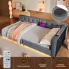 A modern bed with LED lighting and integrated charging ports, shown in a bedroom setting with decorative elements. Produktbild-Vorschau
