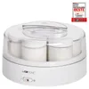 A white yogurt maker with seven glass jars inside, shown from a slightly elevated front angle against a white background. A clear plastic lid covers the yogurt maker. Náhľad obrázku produktu