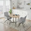 A dining set with two chairs and a round table in a bright, modern kitchen setting. Náhled obrázku produktu