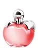 A studio shot of a pink apple-shaped perfume bottle with a silver cap and leaf accents. Náhľad obrázku produktu