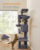 A multi-level cat tree with two cats interacting with it, placed indoors near a window. Produktbild-Vorschau