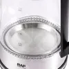 A close-up view of the top portion of a glass electric kettle, showing the metallic base and part of the handle. Produktbild-Vorschau