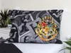 A Harry Potter themed pillowcase is displayed on a bed. Náhled obrázku produktu