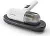 A white and gray handheld vacuum cleaner with a transparent dustbin sits on a black charging base against a white background. Voir les images du produit