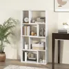 A white bookshelf filled with various decorative items and books, placed in a room with a plant and a desk. Podgląd zdjęcia produktu