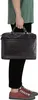A person is holding a black briefcase. Produktbild-Vorschau