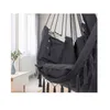 A close-up view of a hanging chair with pockets, showing glasses and a magazine inside. Produktbild-Vorschau