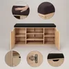 A shoe cabinet with a padded seat on top, shown with close-up details of the cushion and hinges. Náhľad obrázku produktu