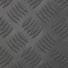 A close-up, textured view of a dark gray rubber mat with a diamond cut pattern. Produktbild-Vorschau