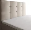 A close-up view of a bed with a tufted headboard and a white mattress. Produktbild-Vorschau