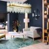 A luxurious living room with a modern chandelier, armchair, coffee table, and decorative screen. Náhľad obrázku produktu