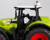 Close-up view of a toy tractor's cabin and wheel. Produktbild-Vorschau