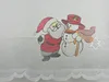 A close-up of a Christmas-themed curtain with embroidered figures of Santa Claus and a snowman. Produktbild-Vorschau