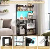 A kitchen shelf unit with various items on it, including a coffee machine and a printer, with lifestyle elements like a sofa in the background. The bottom of the image shows feature callouts. Náhled obrázku produktu