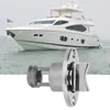 A stainless steel boat drain plug is shown in the foreground with a white yacht in the background. Podgląd zdjęcia produktu