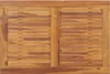 A close-up view of a wooden slatted table top. Náhled obrázku produktu