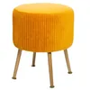 A yellow velvet stool with wooden legs on a white background. Produktbild-Vorschau