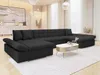A large, dark gray sectional sofa is arranged in a living room setting with a coffee table in front of it. Náhled obrázku produktu