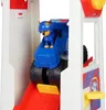 A toy police vehicle with a dog figurine inside a tower structure. Náhľad obrázku produktu