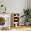A wooden bookshelf with items on it, placed next to a desk and a plant in a room. Podgląd zdjęcia produktu