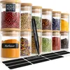 A collection of glass spice jars with bamboo lids, filled with various spices and herbs. A marker is shown writing on a label. Produktbild-Vorschau