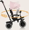 A pink and black tricycle with a sunshade, shown with arrows indicating rotation. Produktbild-Vorschau