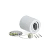 A white cylinder-shaped lamp with its mounting base and screws on a white background. Anteprima dell’immagine prodotto
