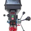 Close-up view of the control panel and operating levers of a drill press. Produktbild-Vorschau