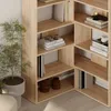 A corner bookshelf unit with various books and decorative items. Produktbild-Vorschau