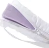 A close-up view of a mattress topper with a zipper partially open, revealing a purple foam interior. Produktbild-Vorschau