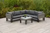 An outdoor sectional sofa and coffee table set on a patio with greenery in the background. Produktbild-Vorschau
