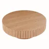 A round wooden coffee table with a fluted base. Produktbild-Vorschau
