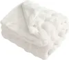 A folded white plush blanket. Produktbild-Vorschau